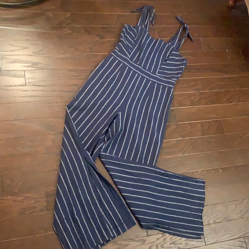 Stripped blue jumpsuit with adjustable tied straps